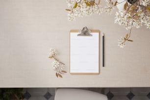 a clipboard with a notepad attached to it