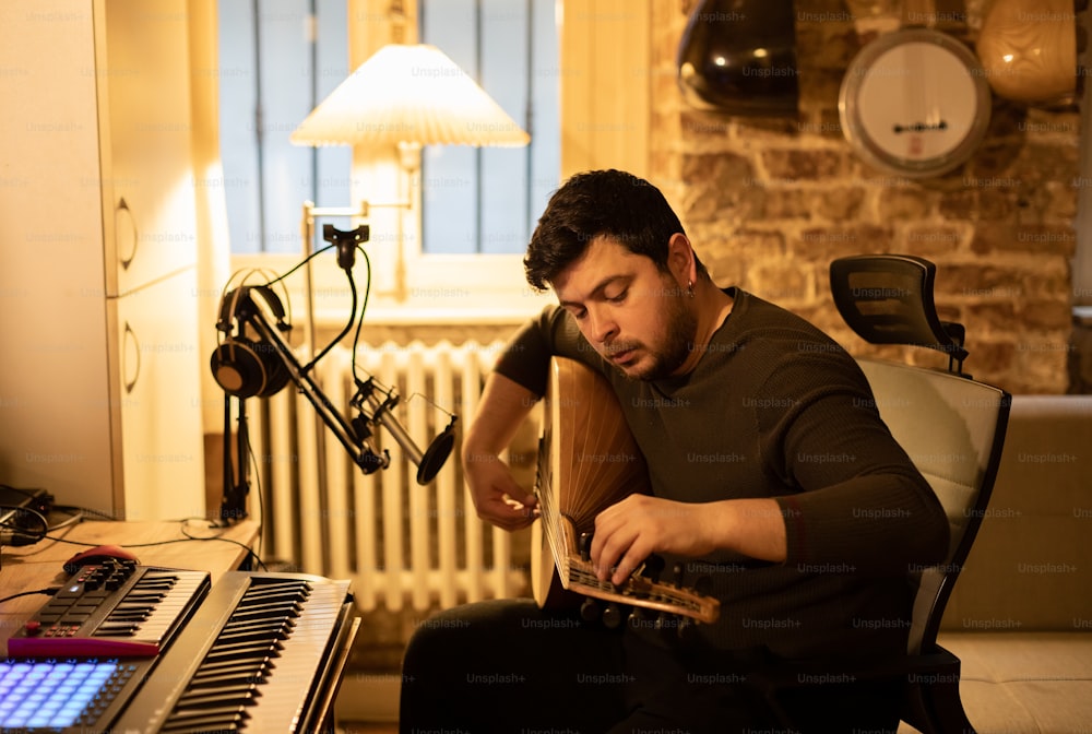 a man sitting in front of a keyboard