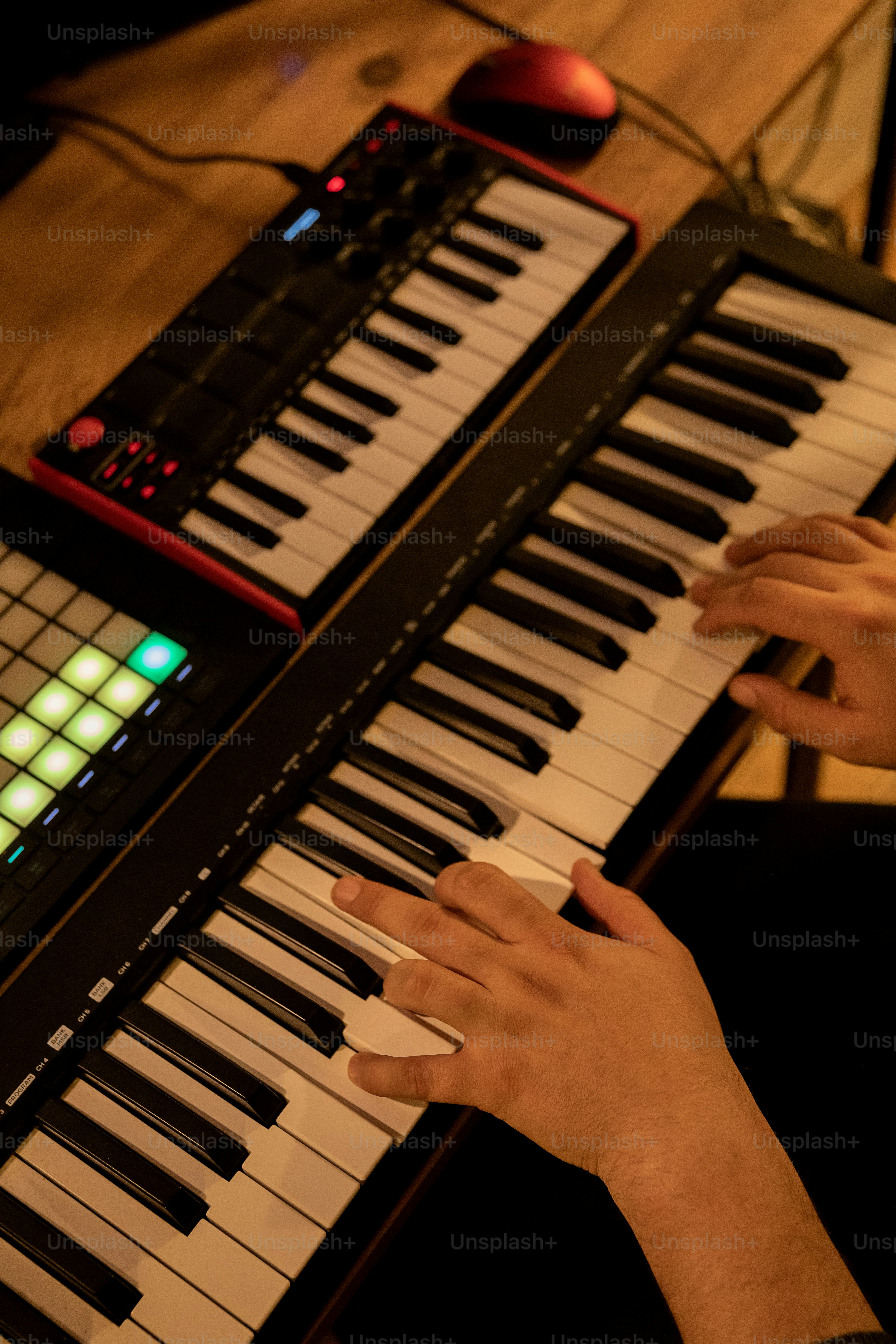 a person sitting at a keyboard playing a musical instrument