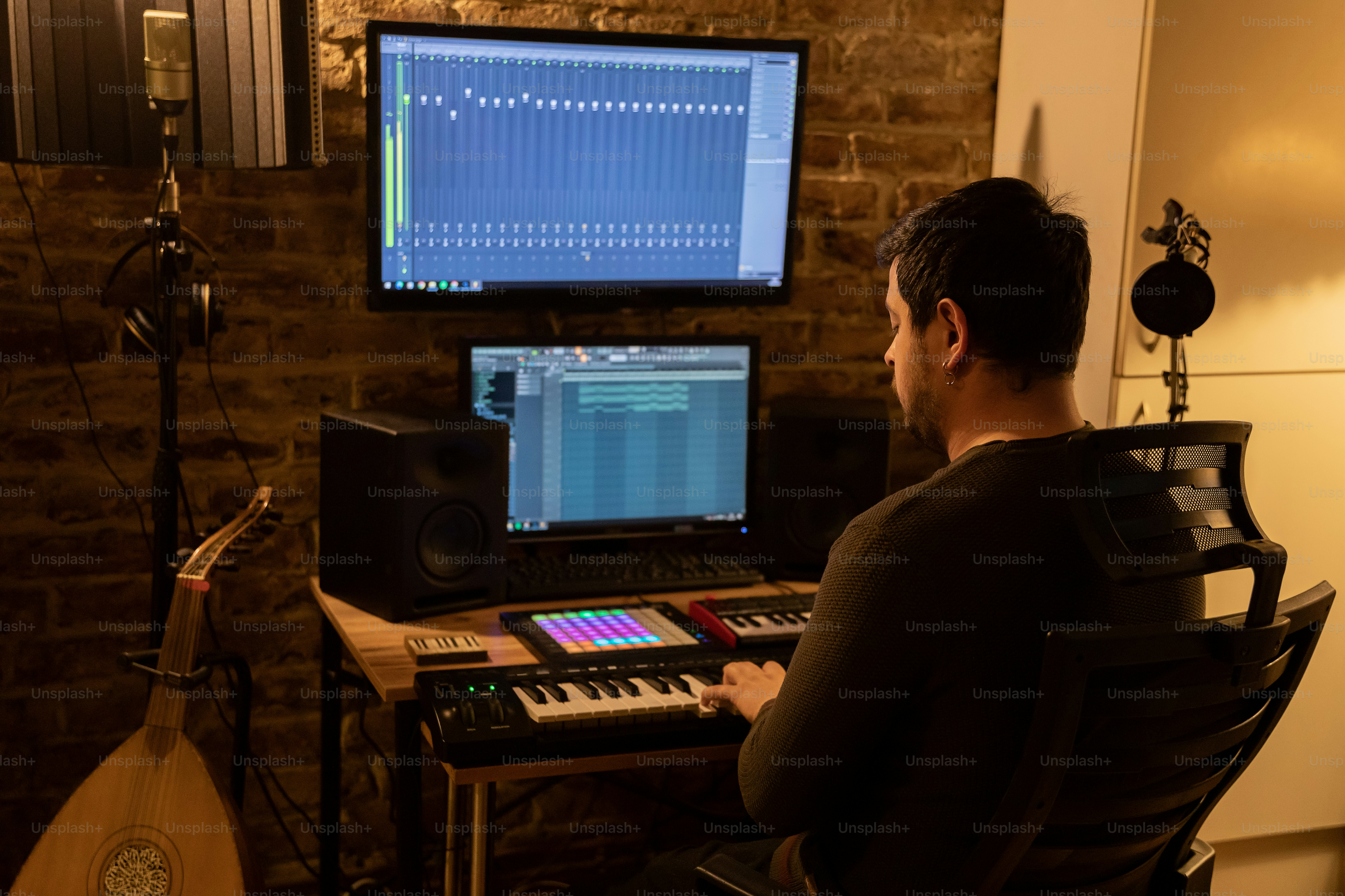 a man sitting in front of a computer monitor