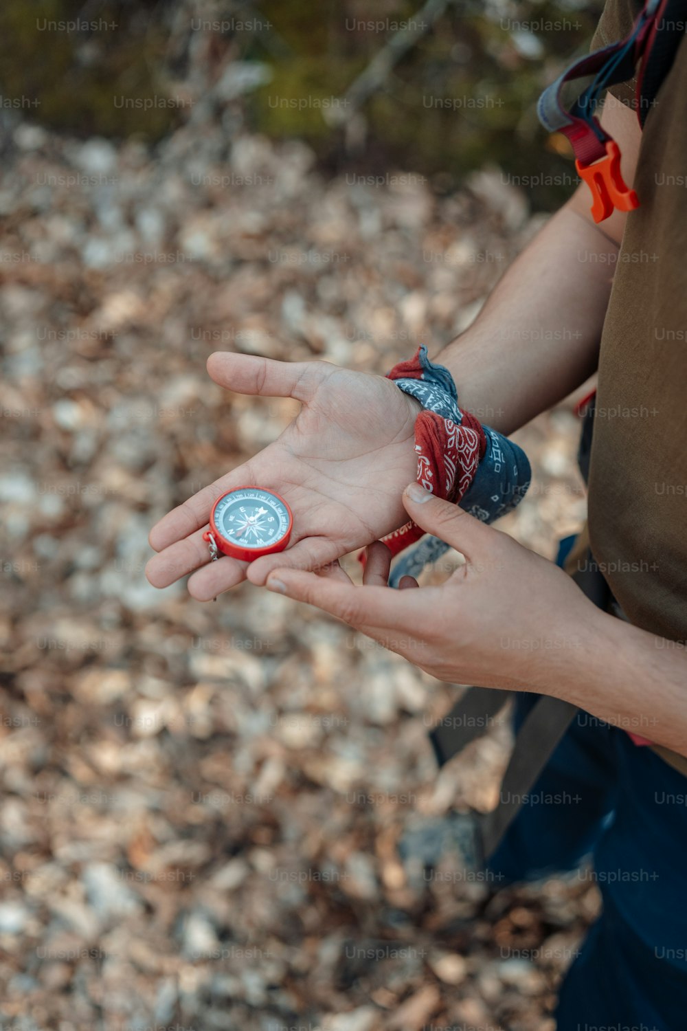 a person holding a compass in their hand