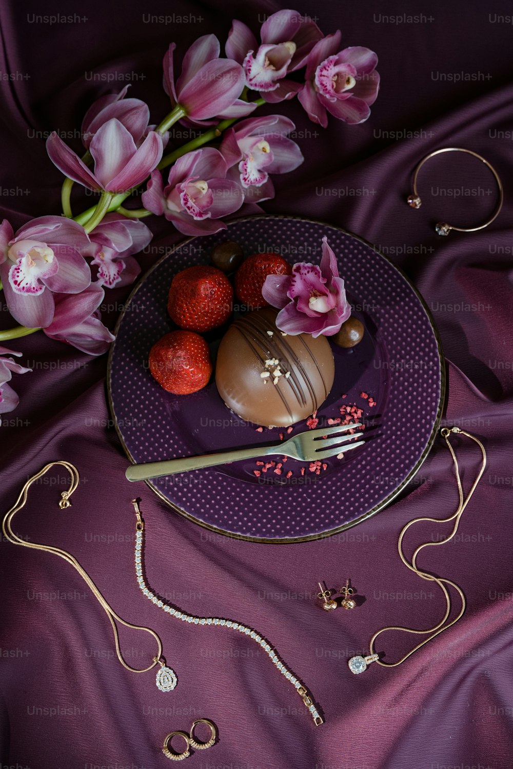 a plate with a chocolate dessert and flowers on it