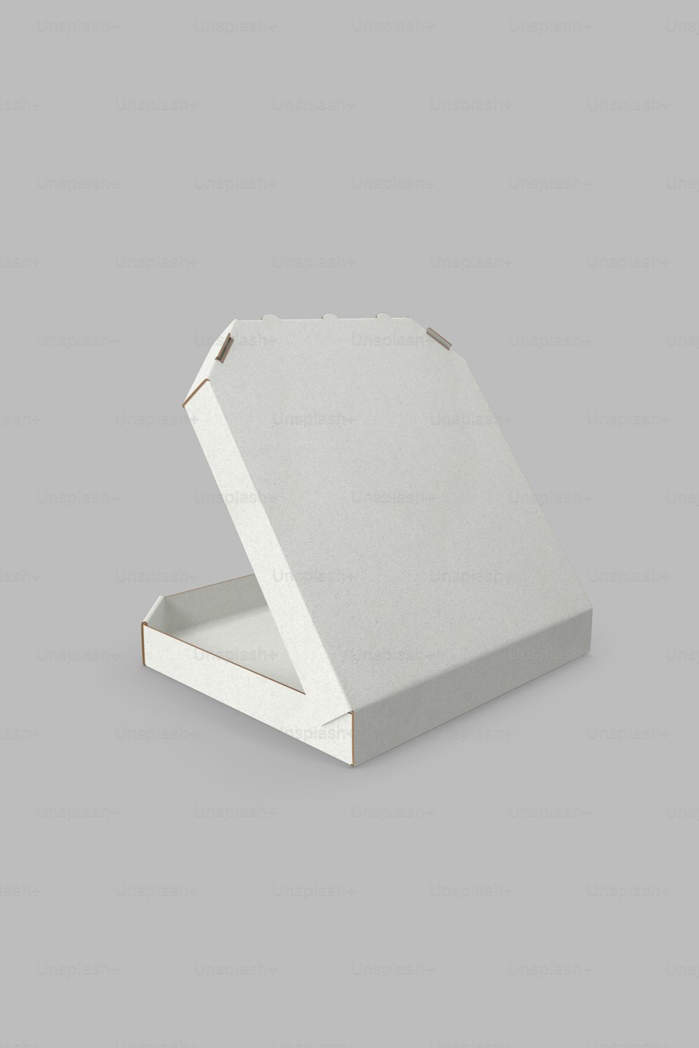 una caja blanca con una tapa cerrada sobre un fondo gris