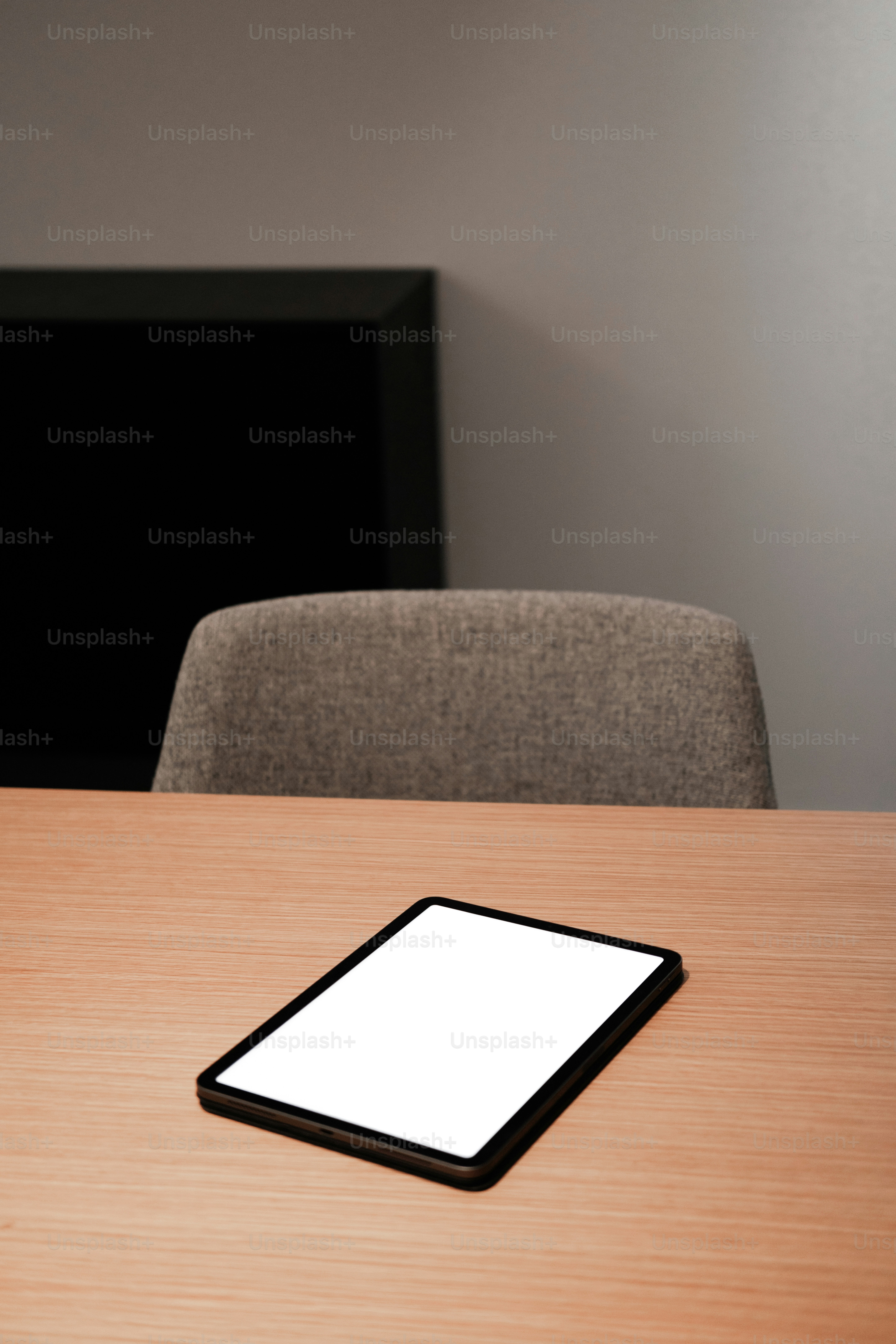 a cell phone sitting on top of a wooden table