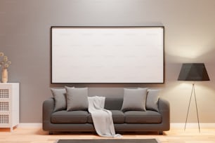 a living room with a gray couch and a large picture frame