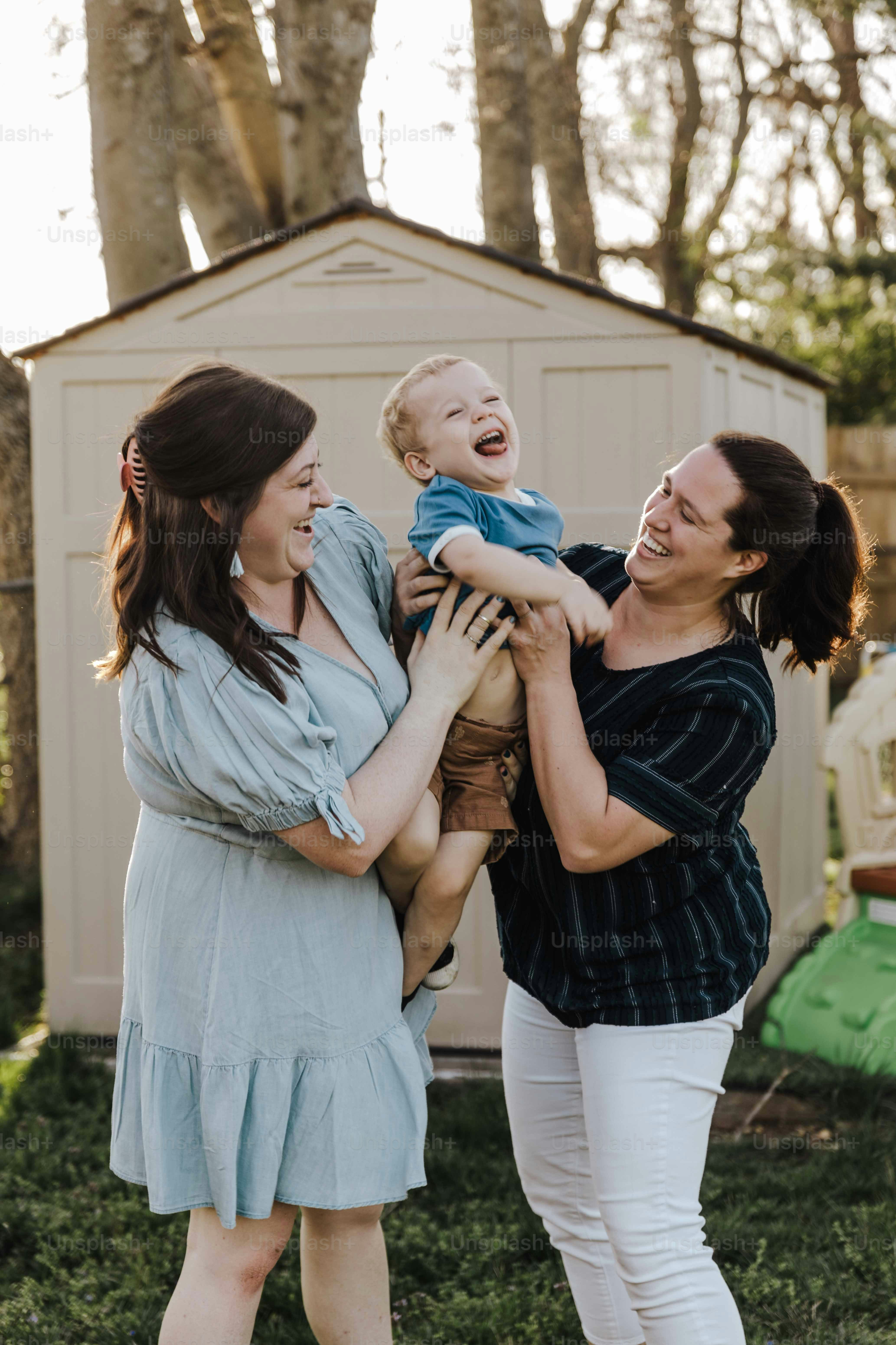 a woman holding a baby in her arms