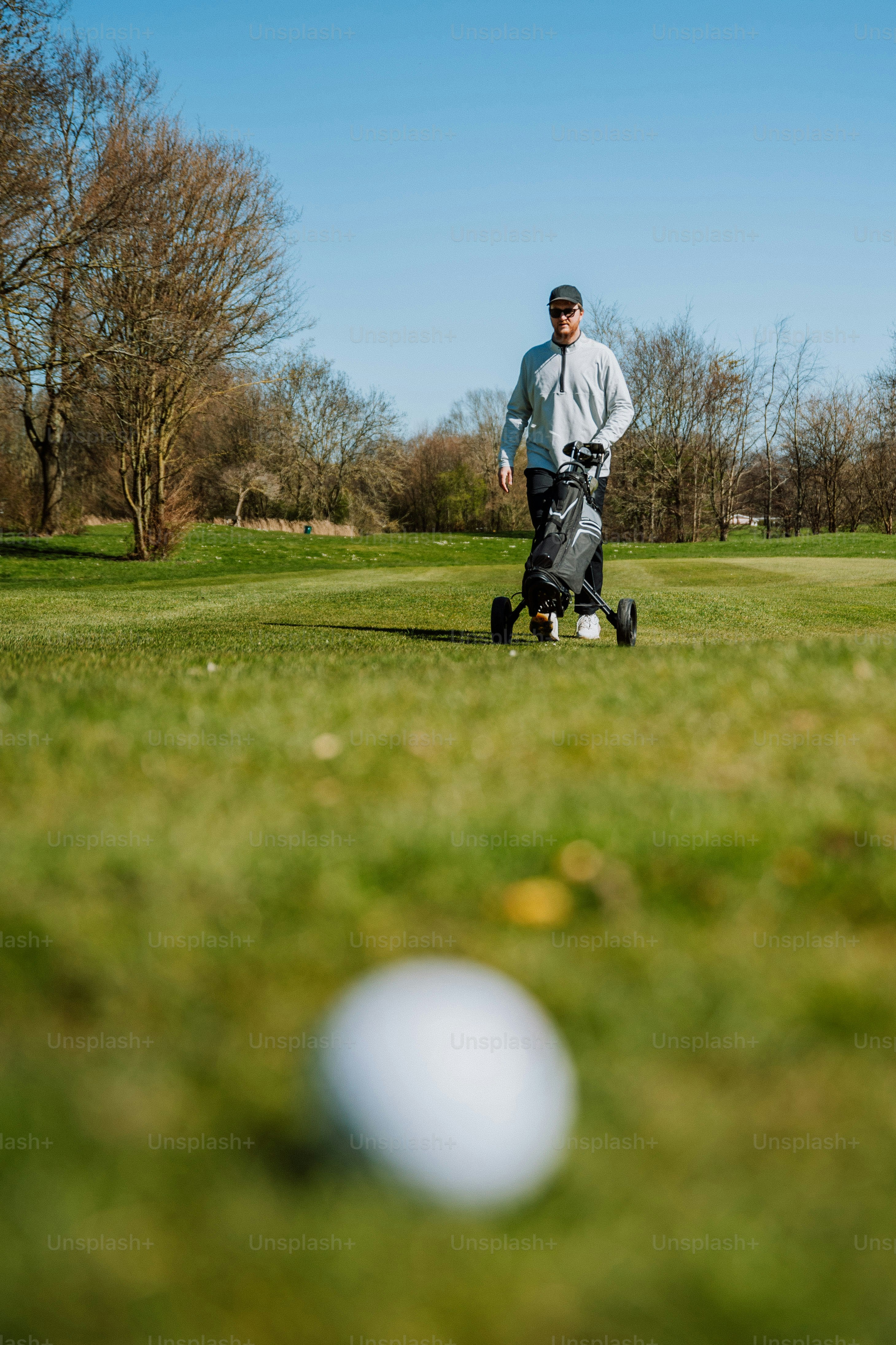 a man standing on top of a lush green field