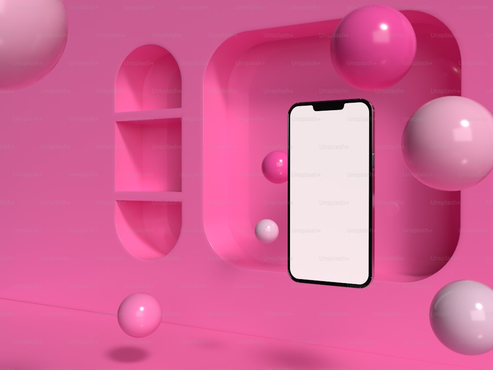 un teléfono celular sentado encima de una superficie rosada