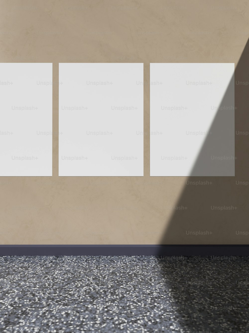 an empty room with three square panels on the wall