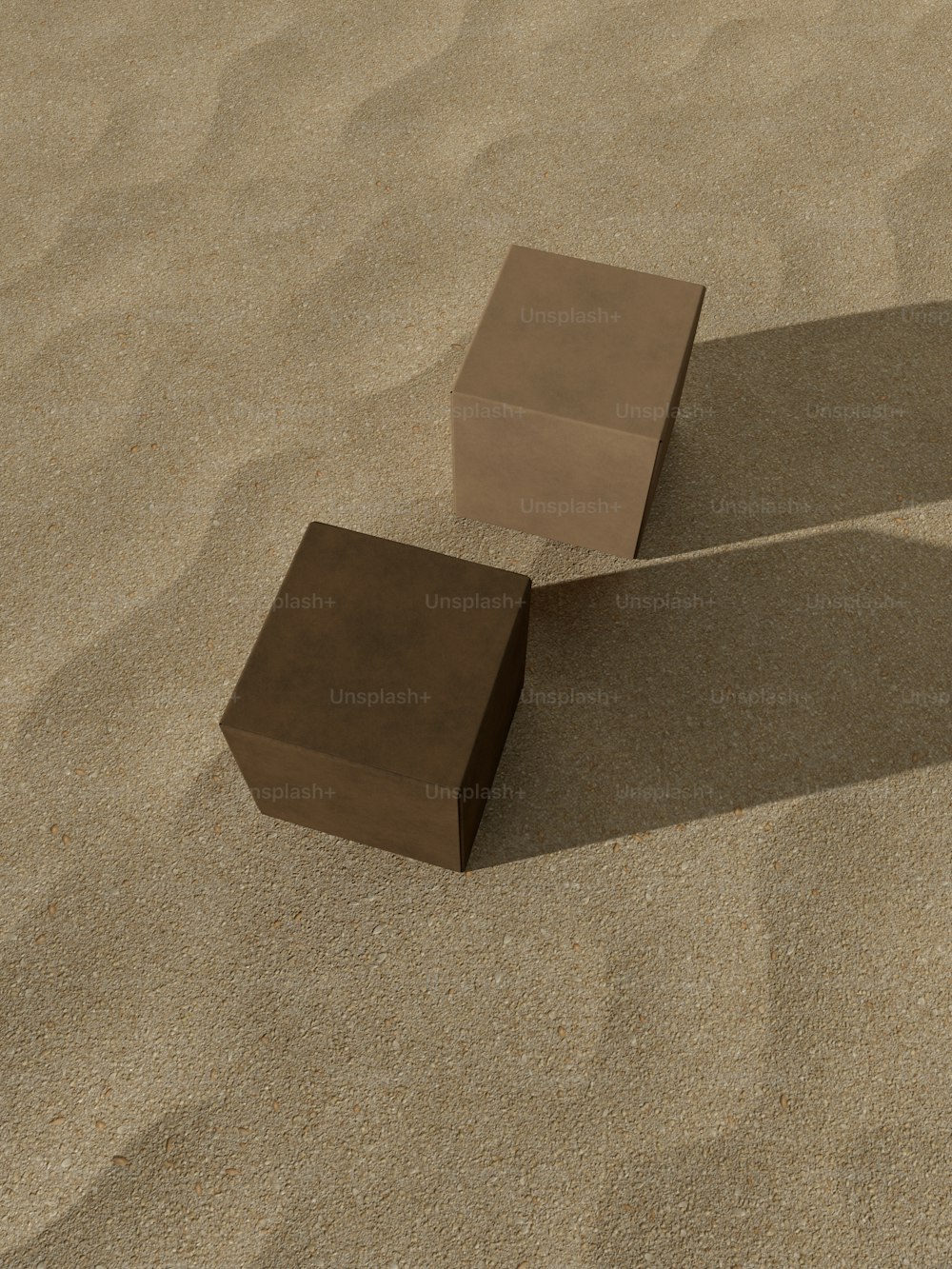 a couple of blocks sitting on top of a sandy beach