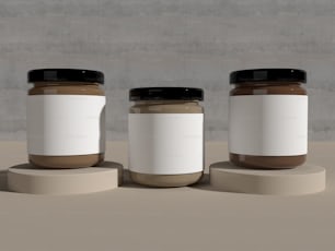 three jars of peanut butter on a table