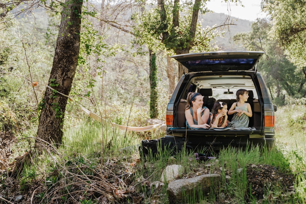 a group of people sitting in the back of a truck