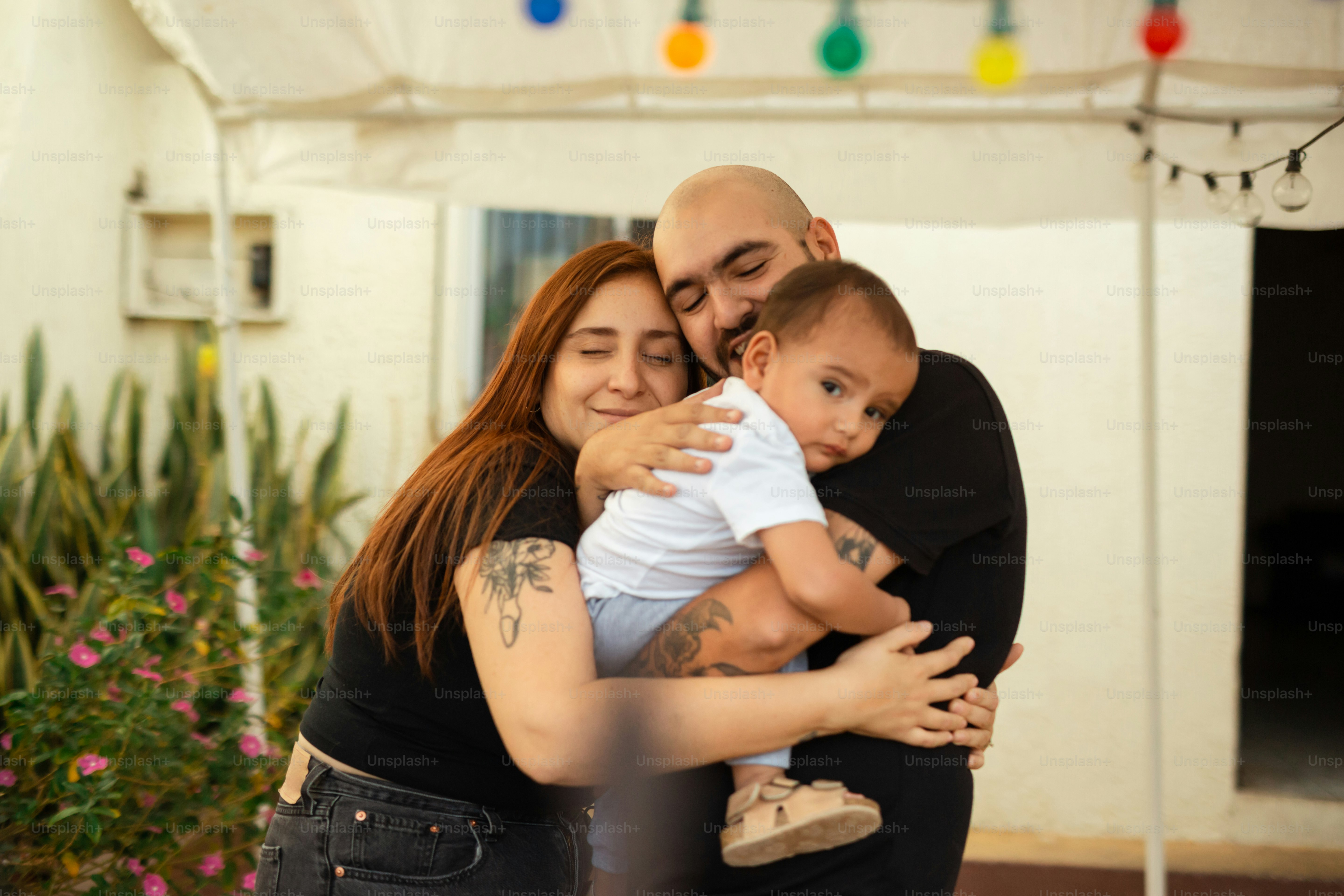 a woman holding a baby in her arms