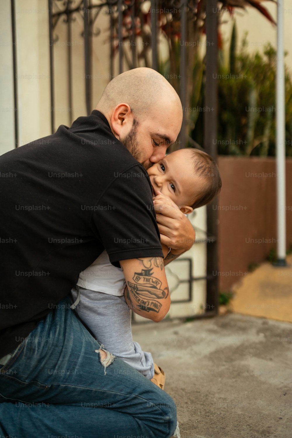 a man holding a baby in his lap
