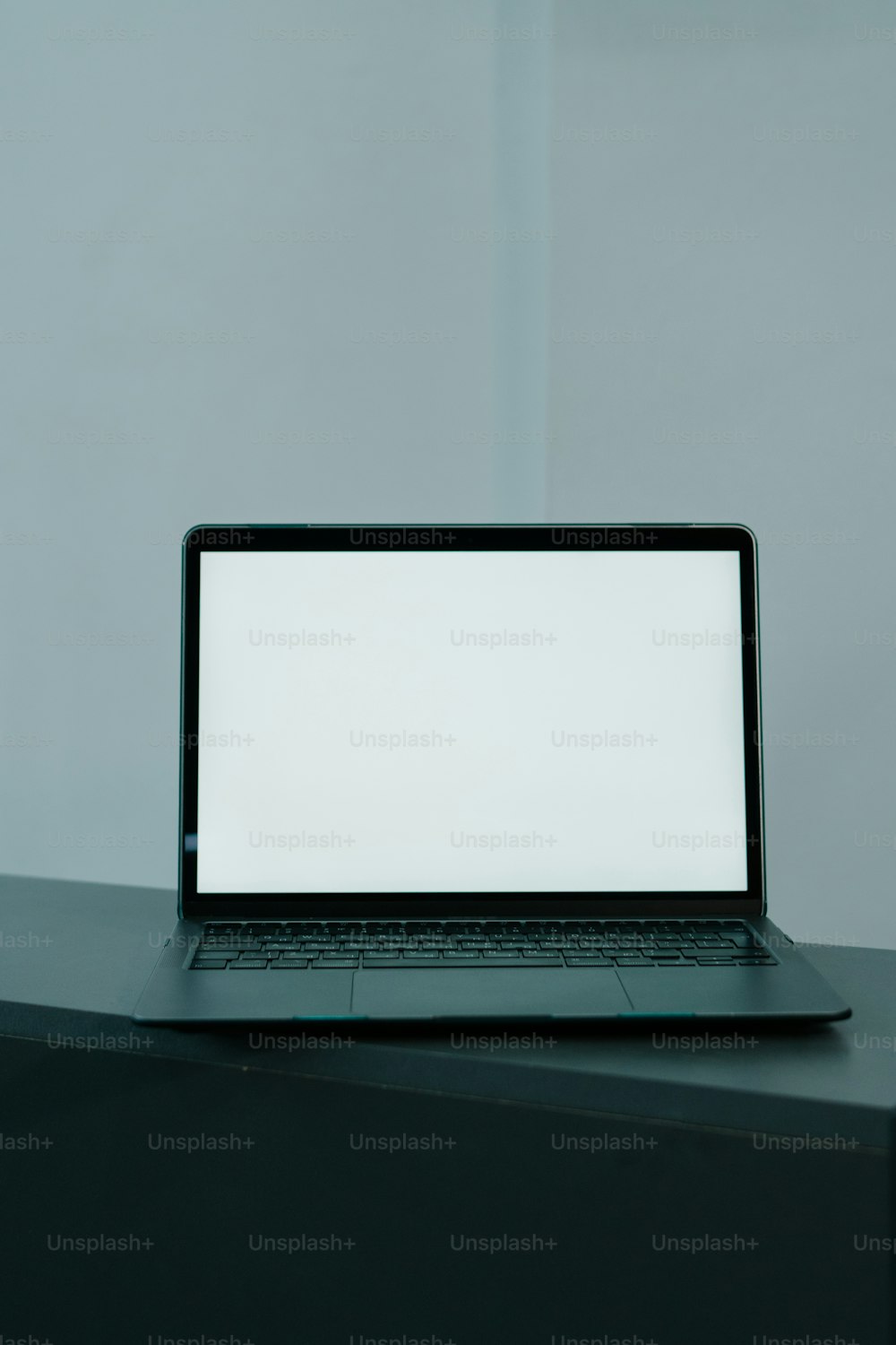 a laptop computer sitting on top of a desk