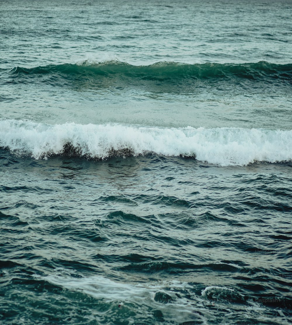 a large body of water with waves coming in