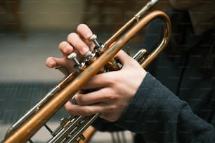 a close up of a person playing a trumpet