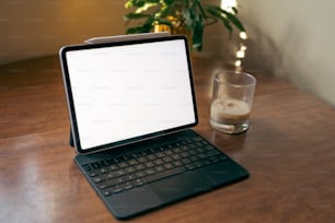 a laptop computer sitting on top of a wooden table