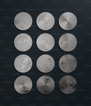 a set of six silver coins on a black surface