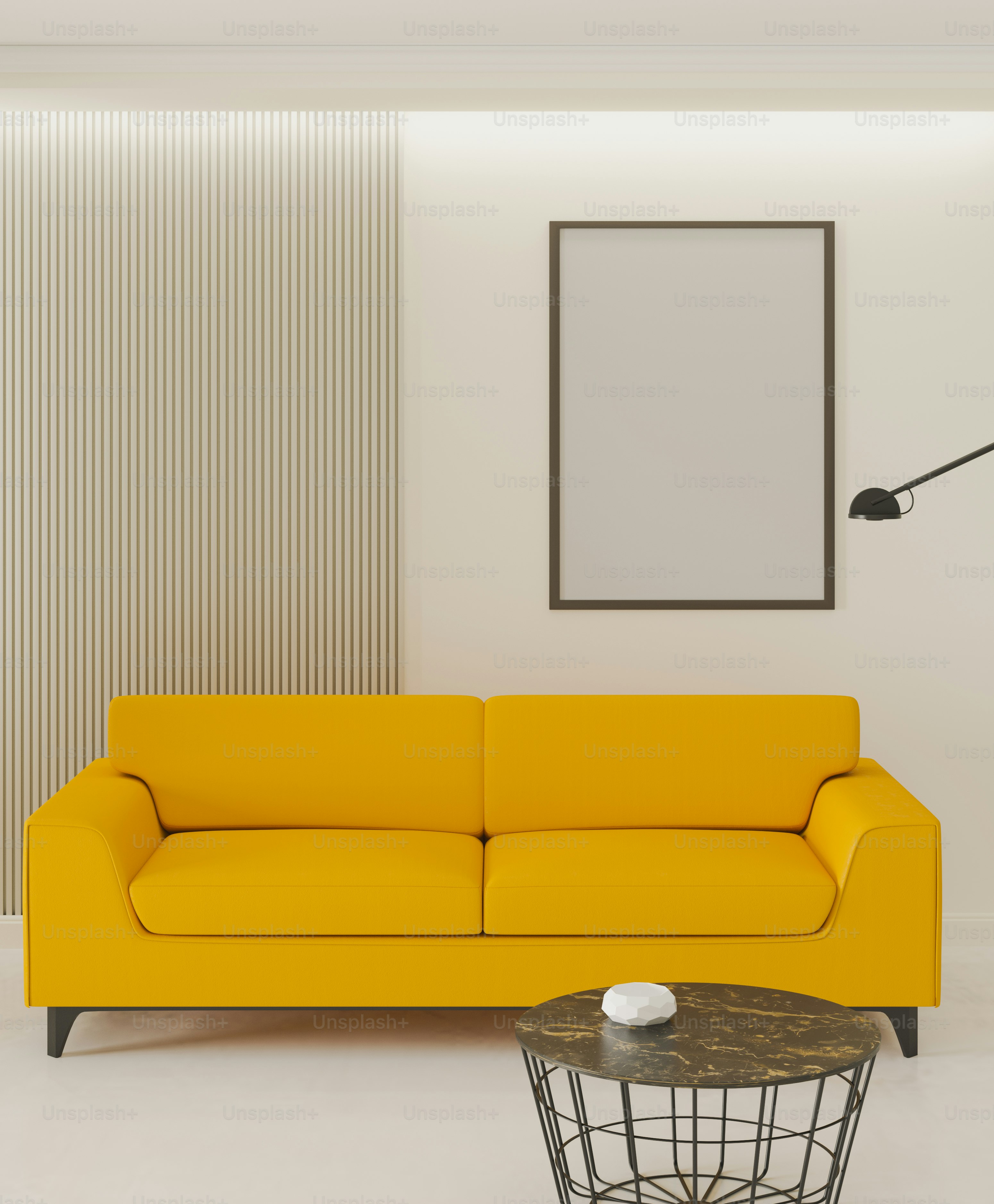 a living room with a yellow couch and a table