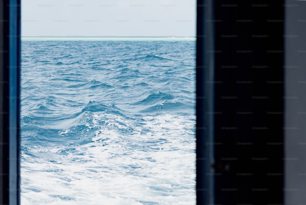 a view of the ocean through a window