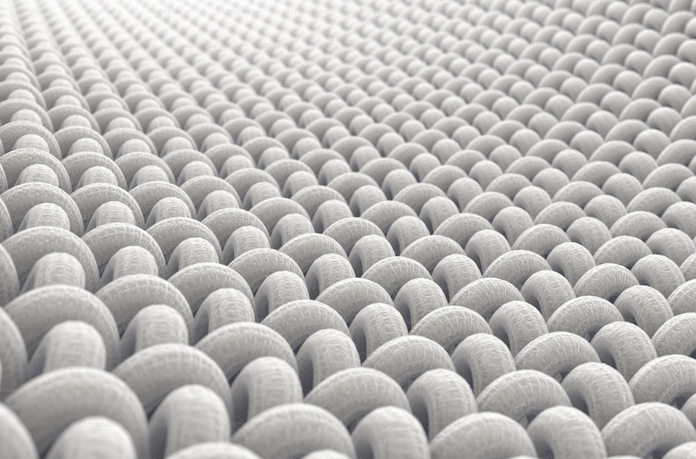 A microscopic close up view of a simple woven textile on a white background - 3D render