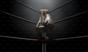 Gros plan du coin d’un vieux ring de boxe vintage entouré de cordes éclairées par un projecteur sur un fond sombre isolé - Rendu 3D