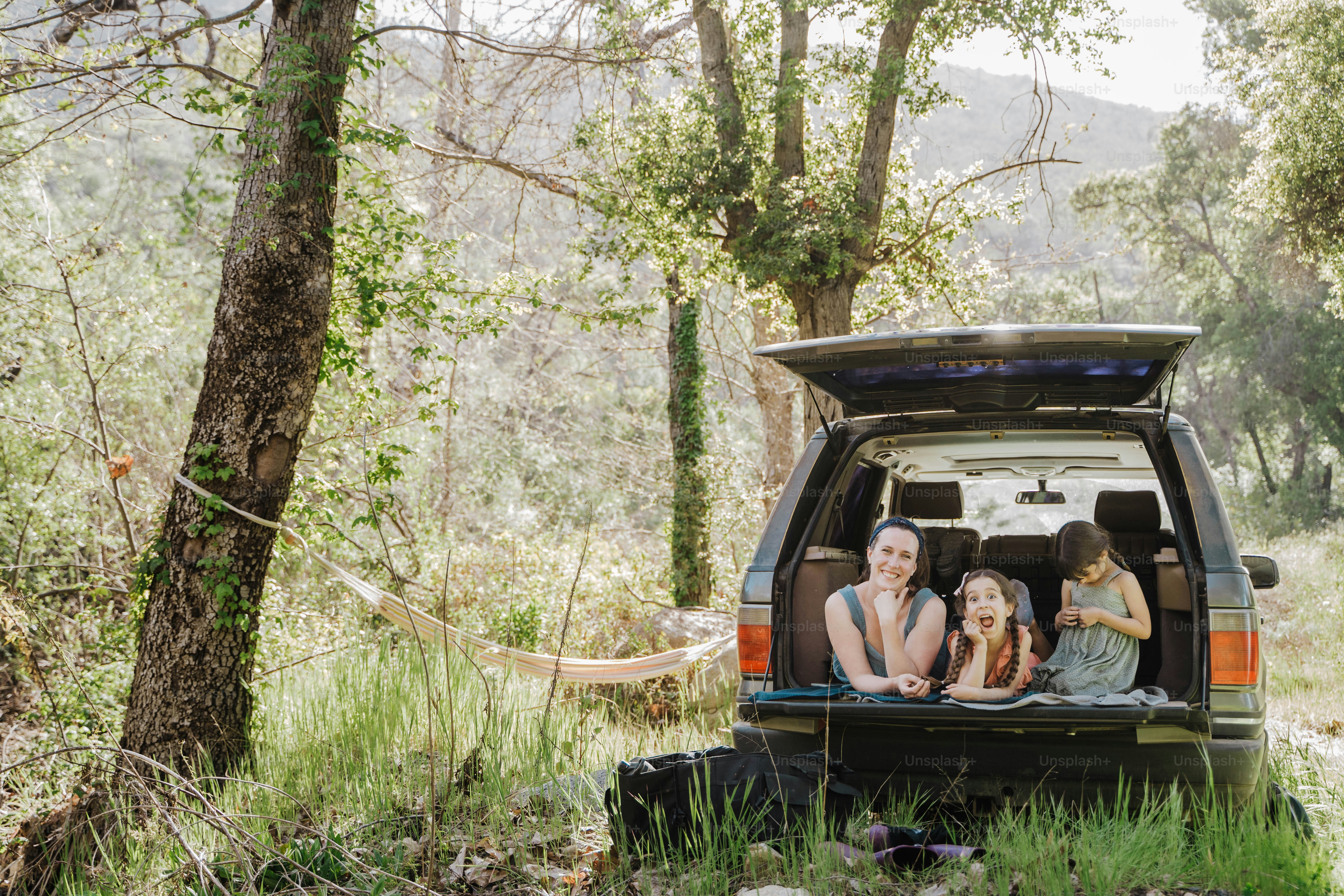 a group of people sitting in the back of a van