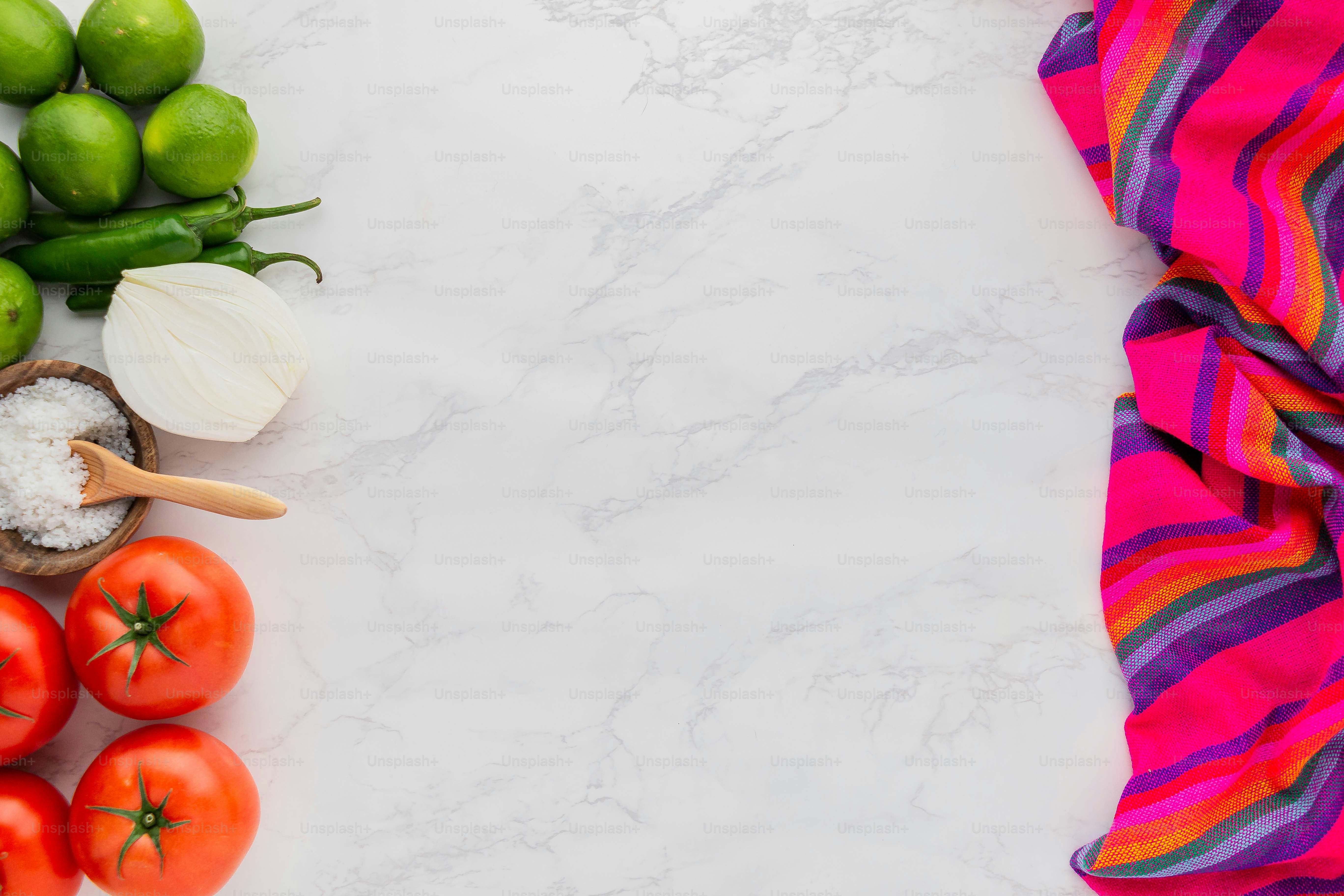 a table topped with lots of different types of vegetables