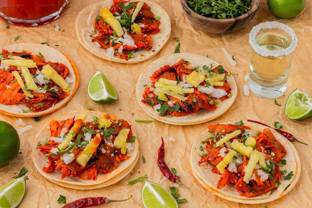 a table topped with tortillas covered in toppings