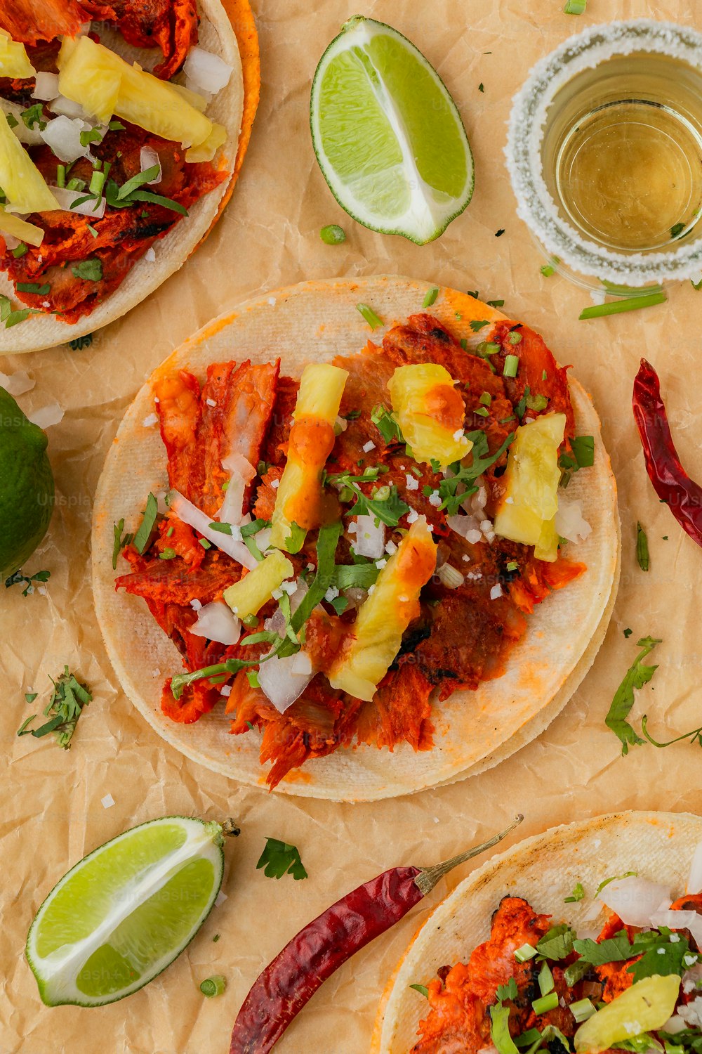 a couple of tacos sitting on top of a table