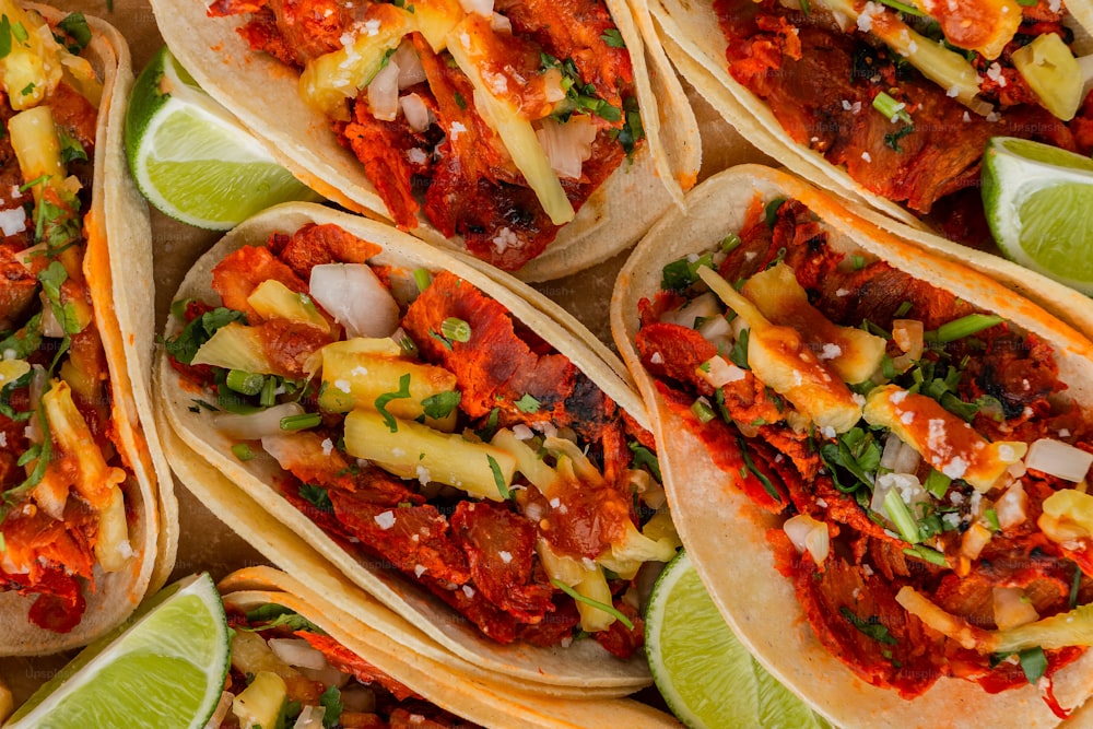 a group of tacos sitting on top of each other