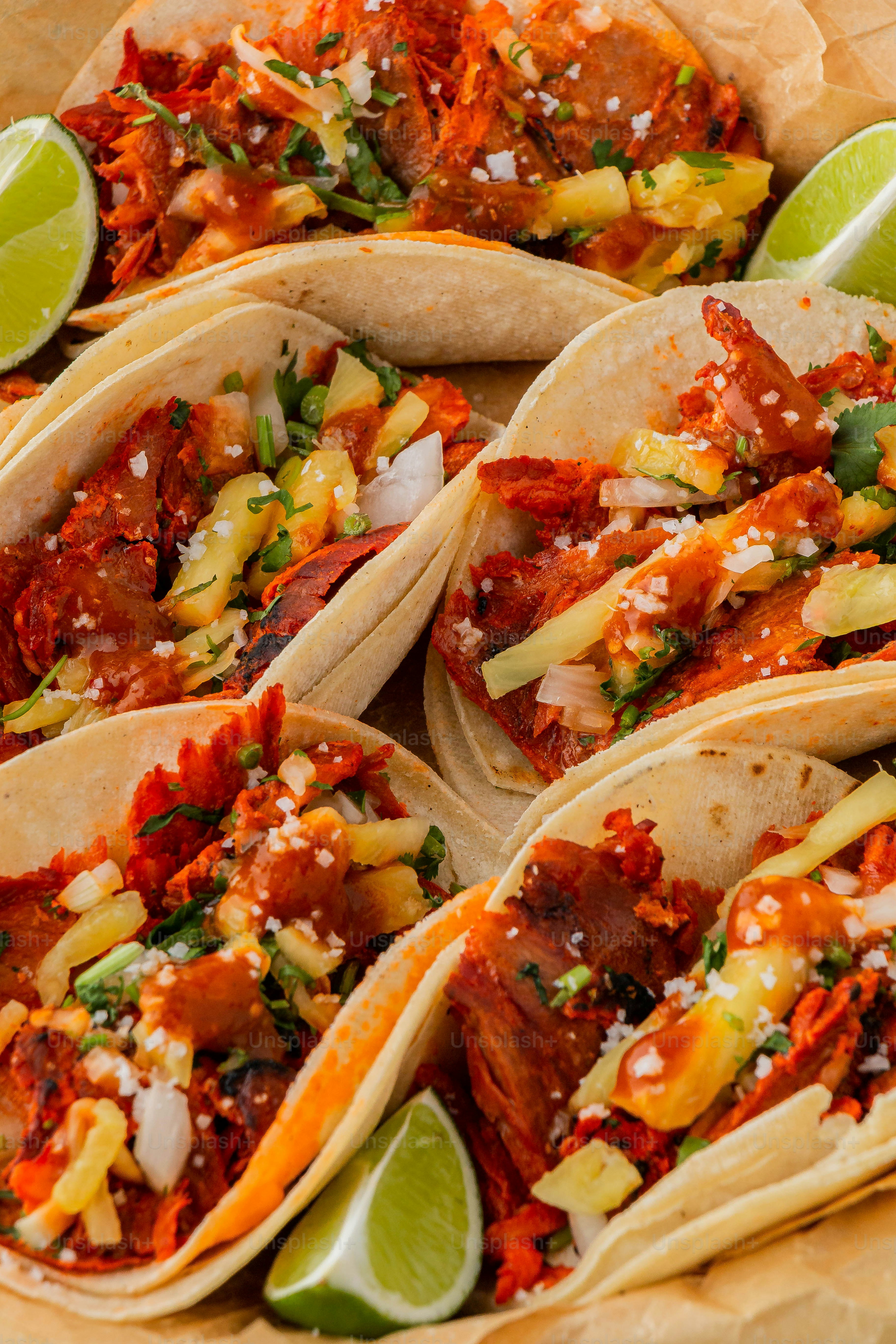 a plate of tacos with meat and vegetables