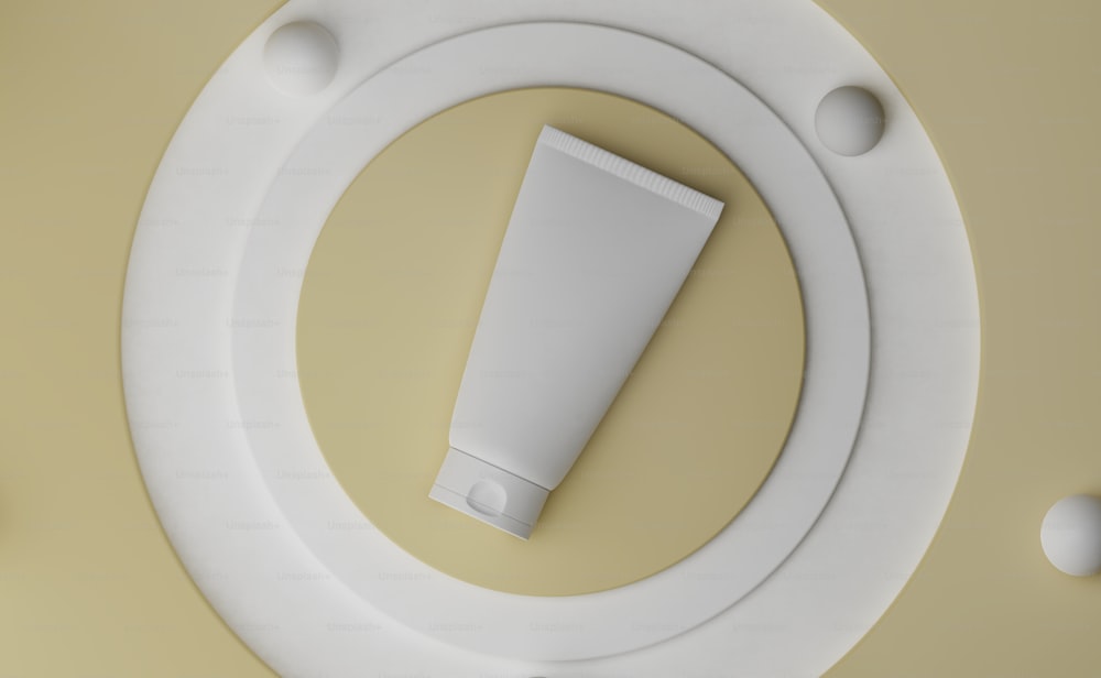 a tube of cream sitting on top of a white object