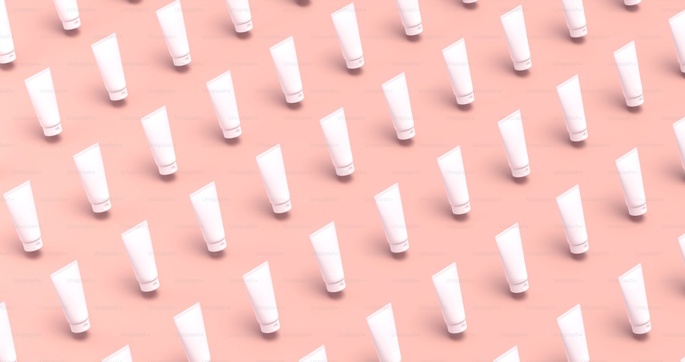 a lot of white tubes on a pink background
