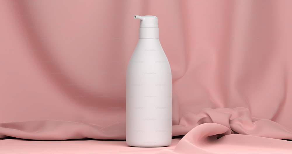a white bottle sitting on top of a pink cloth