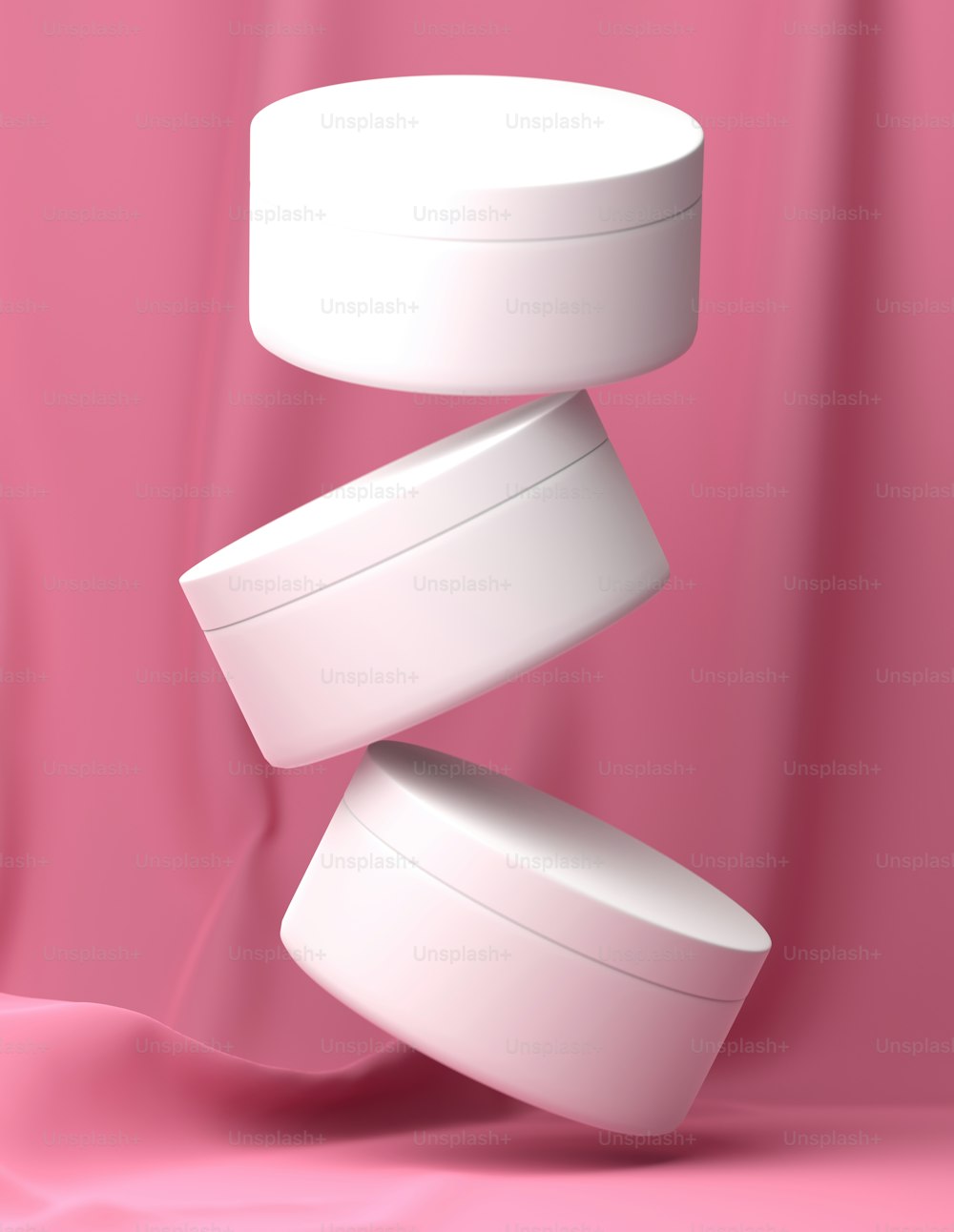 three white containers stacked on top of each other