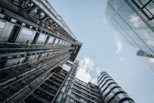 looking up at tall buildings in a city