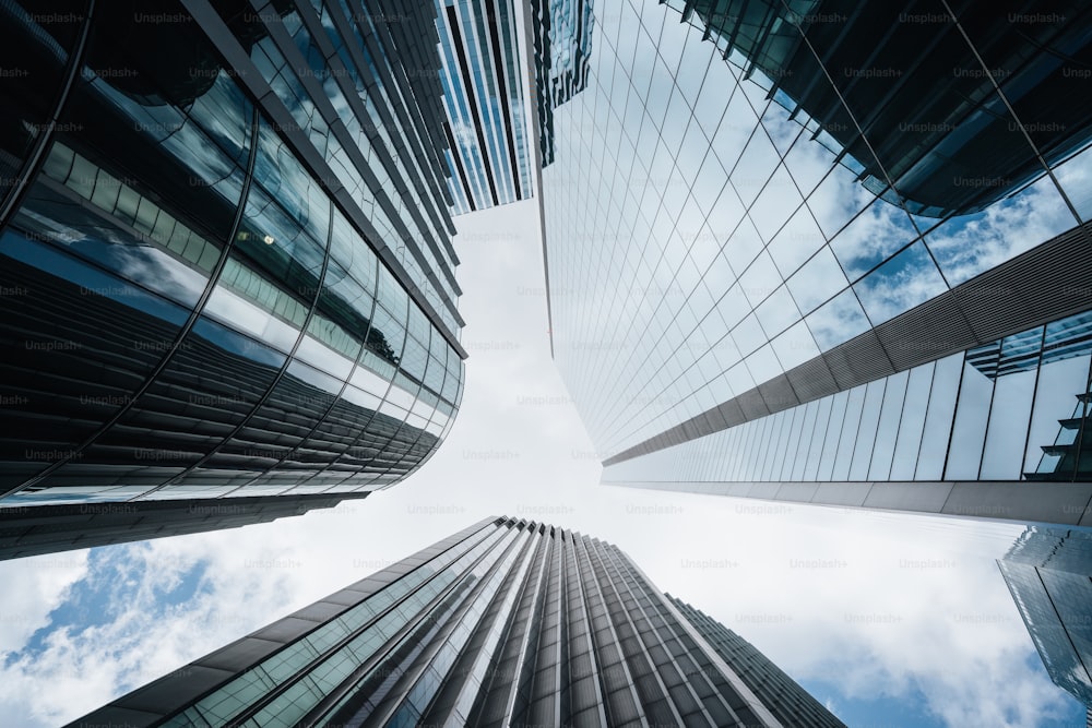 looking up at tall buildings in a city