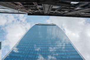 a very tall building with a sky background