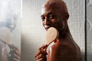 a man brushing his teeth in front of a mirror