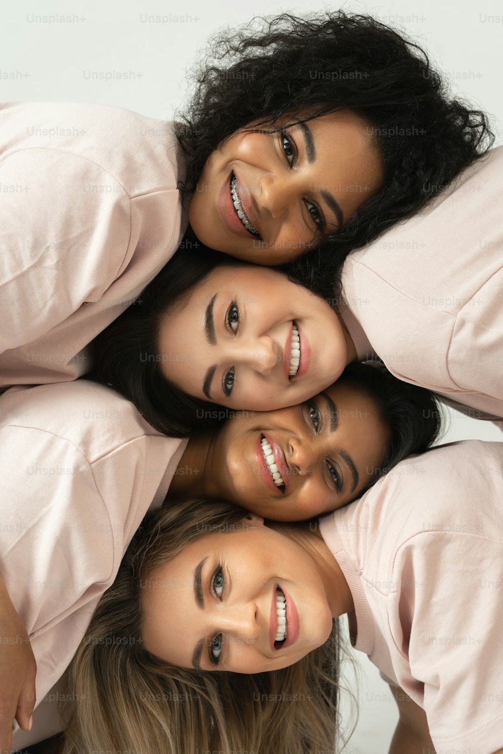 Group of different ethnicity women. Multicultural diversity and friendship. Female faces with different skin type and color.