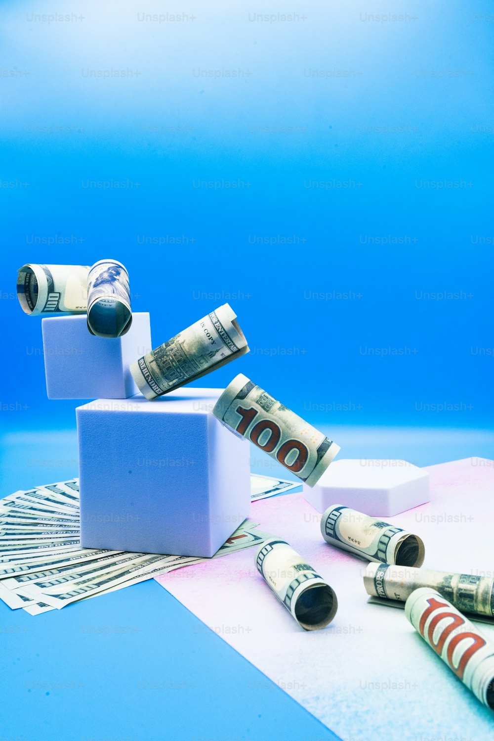 a bunch of rolled up money sitting on top of a table