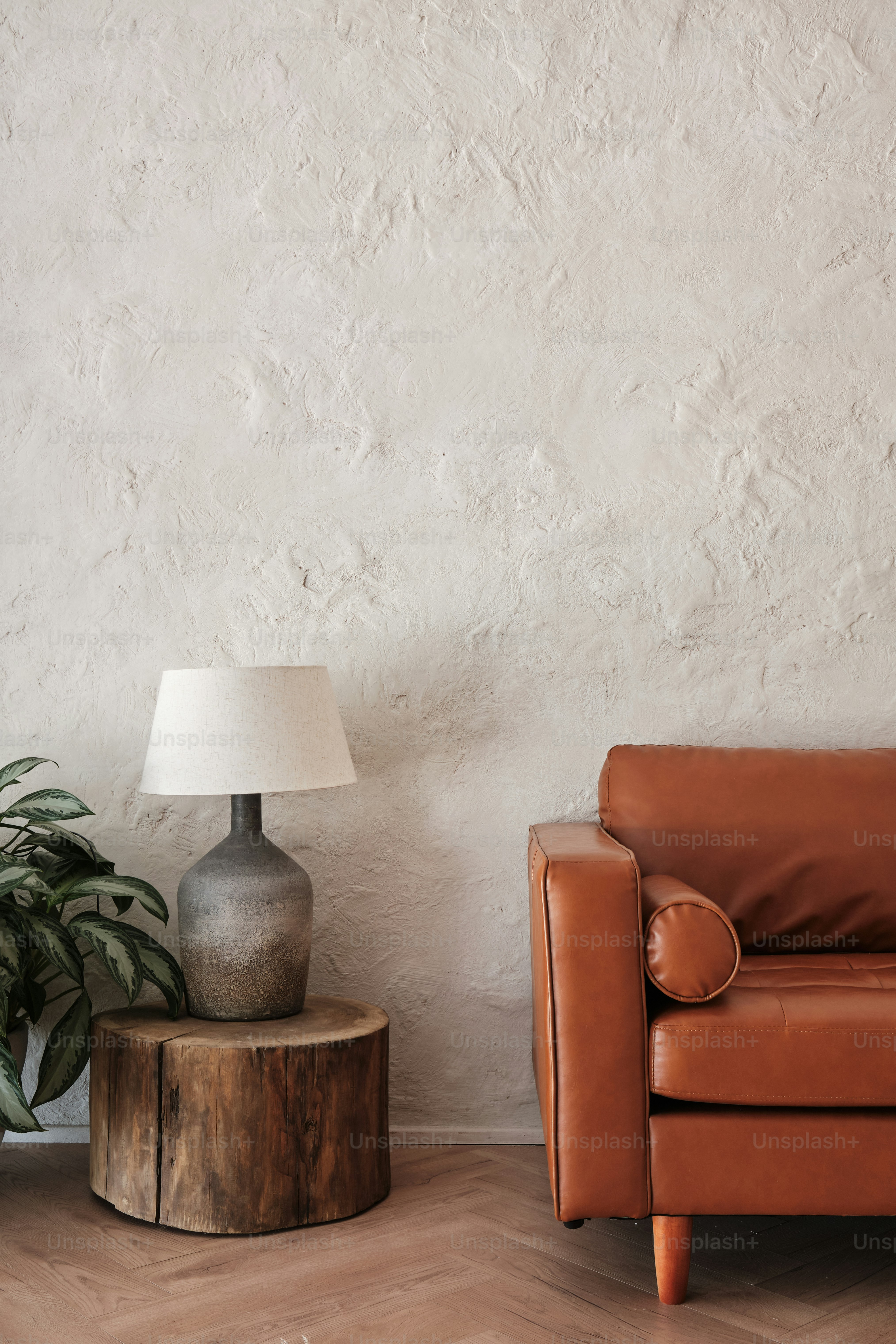 a living room with a leather chair and a table