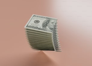 a stack of money sitting on top of a table