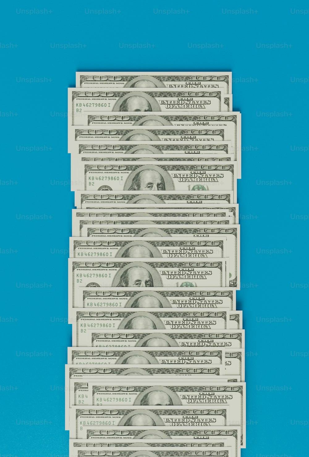 a stack of twenty dollar bills on a blue background