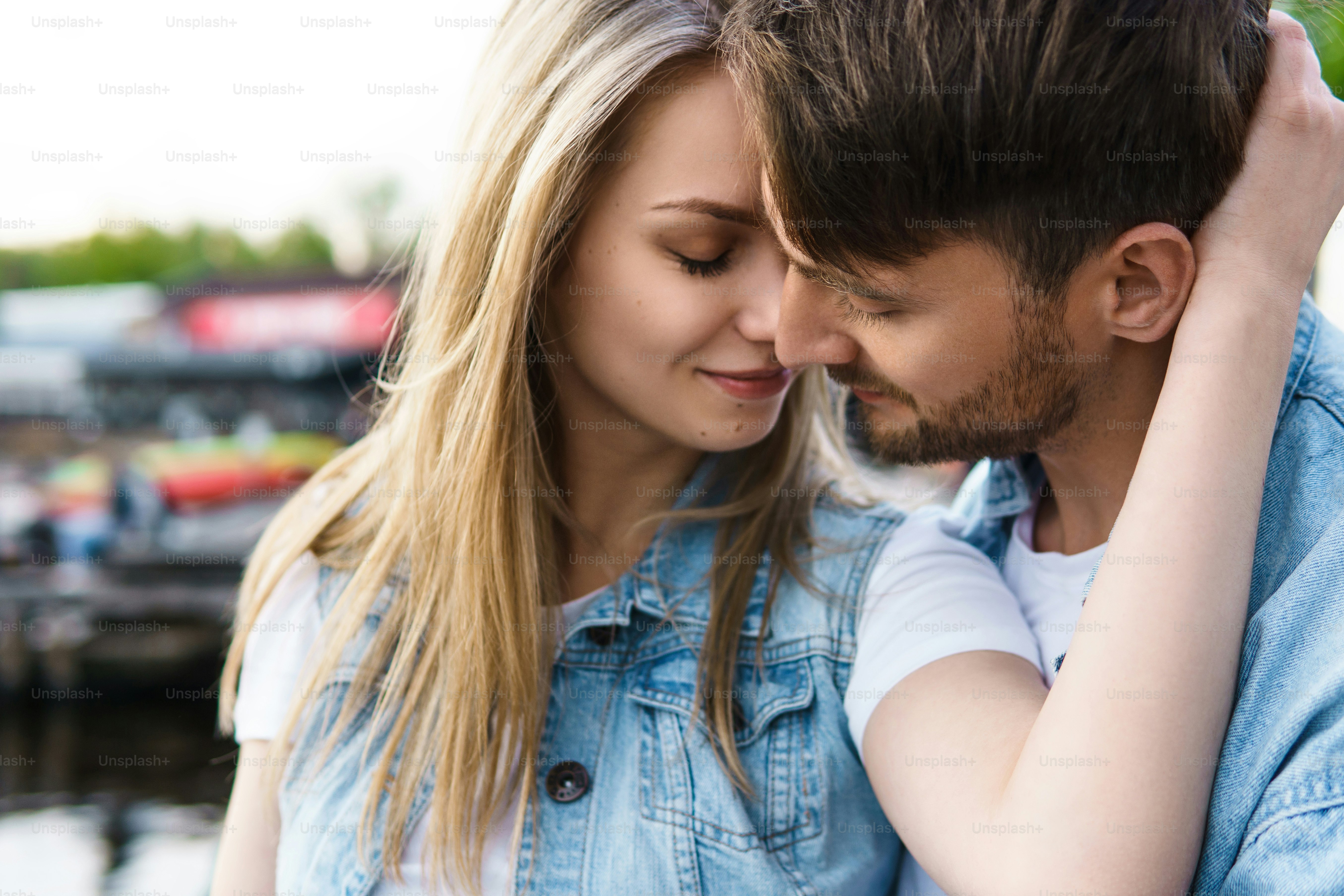 Portrait of young sensual and loving couple during a date outdoors