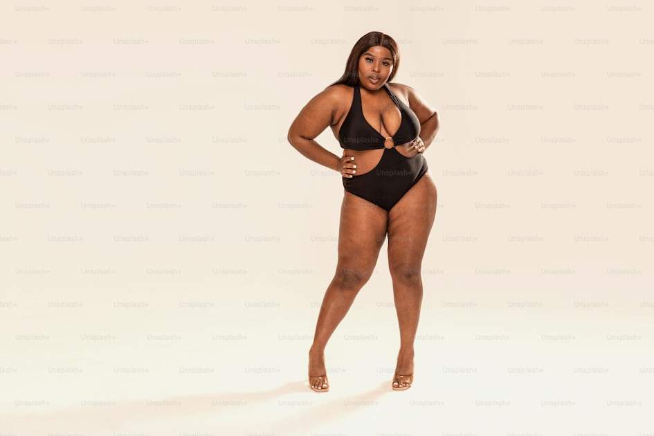 A woman in a tan bodysuit posing for a picture photo – Losing weight Image  on Unsplash