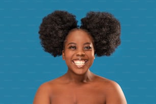 Happy woman smiling. Beauty female portrait. Young emotional afro woman. Real people emotions, facial expression concept.