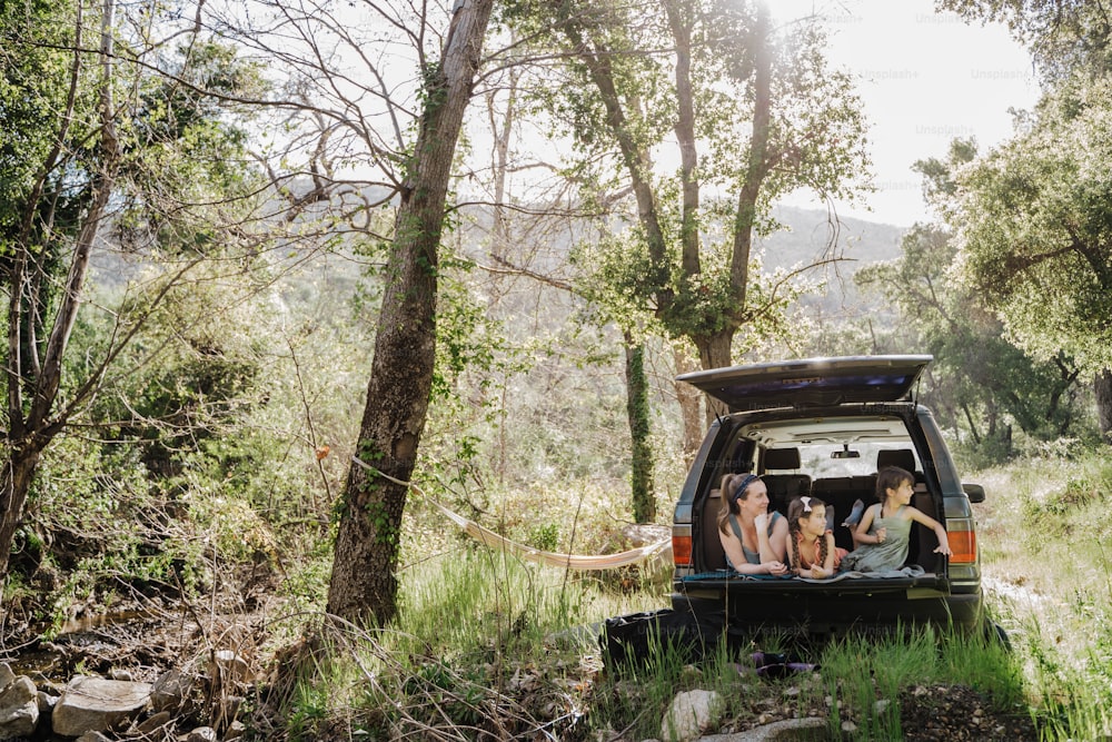 a group of people sitting in the back of a truck